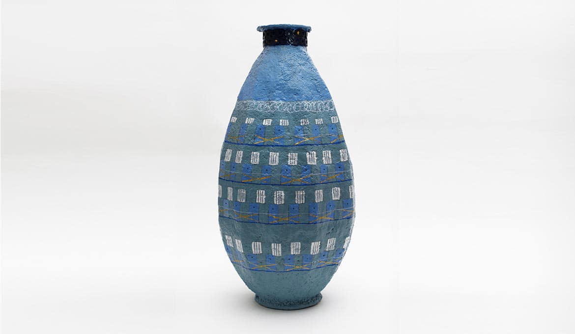 A photo of a blue vase.