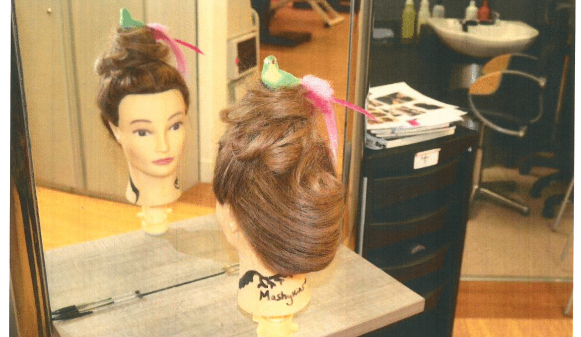 A photo of a mannequin head with a wig on.