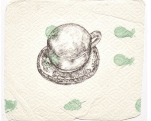 A photo of a napkin with a little teacup on it.