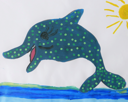 A drawing of a dolphin with green spots jumping out of the water.