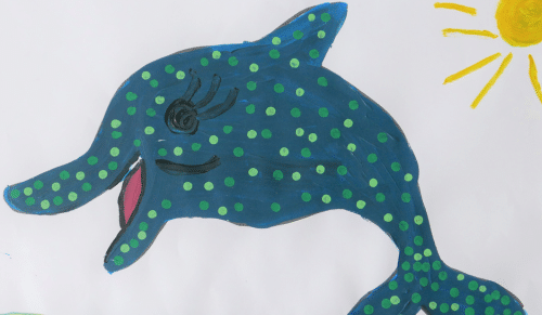 A painting of a blue dolphin with green spots with a sun in the corner.