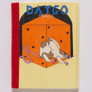 Front cover of a yellow handmade book with red binding on left side. The front has 'DAYGO' text, white and brown mouse, and giant angular orange cheese.